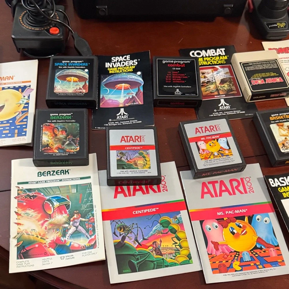 Vintage Authentic Atari 2600 with controllers, games and instruction booklets.